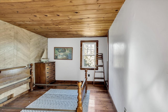 unfurnished bedroom with wood ceiling, dark hardwood / wood-style floors, and vaulted ceiling