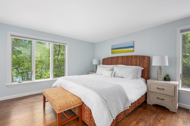23 Walkerwoods Dr, Harwich, MA 02645 - bedroom with baseboards and dark wood-style flooring