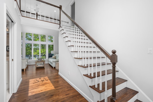 23 Walkerwoods Dr, Harwich, MA 02645 - stairs with wood finished floors and baseboards