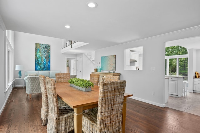 23 Walkerwoods Dr, Harwich, MA 02645 - dining area with stairway, wood finished floors, ornamental molding, and recessed lighting