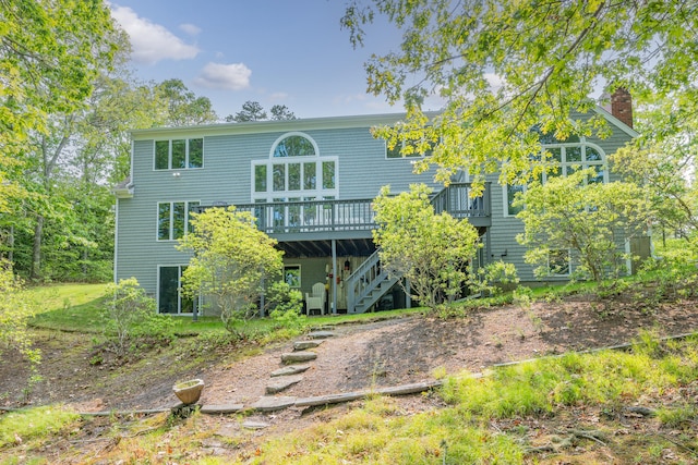 23 Walkerwoods Dr, Harwich, MA 02645 - rear view of property with a deck, stairs, and a chimney