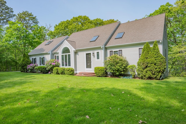 23 Walkerwoods Dr, Harwich, MA 02645 - view of front of property featuring a front lawn and a shingled roof