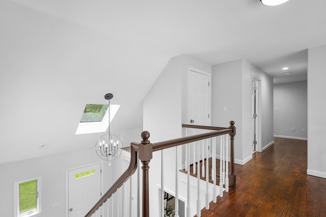 23 Walkerwoods Dr, Harwich, MA 02645 - corridor with an upstairs landing, a skylight, wood finished floors, a chandelier, and lofted ceiling