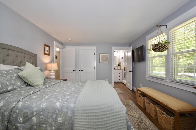 4 Spinnaker Ln, Pocasset, MA 02559 - bedroom featuring wood finished floors, baseboards, and connected bathroom