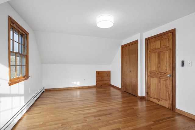 7 George St, Barnstable, MA 02630 - bonus room featuring baseboard heating, light wood-style flooring, vaulted ceiling, and baseboards
