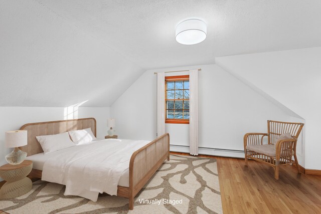 7 George St, Barnstable, MA 02630 - bathroom with a baseboard radiator, vanity, tile walls, shower / bath combination with glass door, and tile patterned flooring