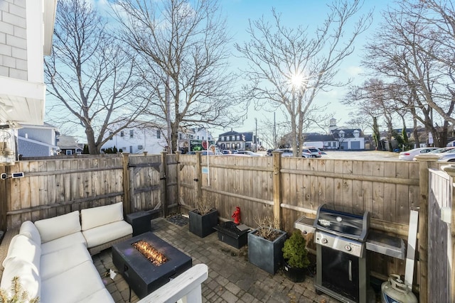 view of patio featuring an outdoor living space with a fire pit