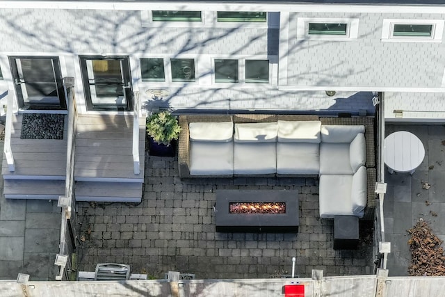 exterior space featuring an outdoor fire pit