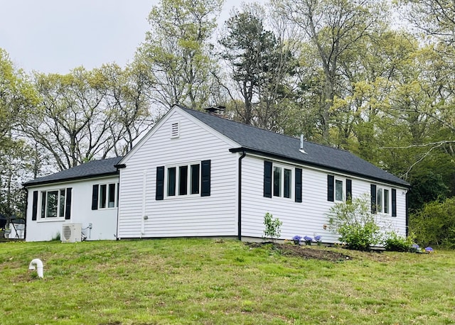 29 Chipman Rd, Sandwich, MA 02563 - back of property featuring a yard, roof with shingles, and ac unit