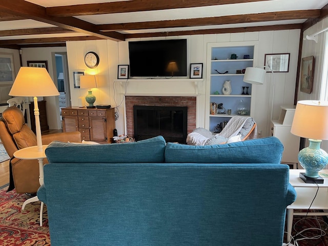 29 Chipman Rd, Sandwich, MA 02563 - living area with a fireplace, beam ceiling, and wood finished floors