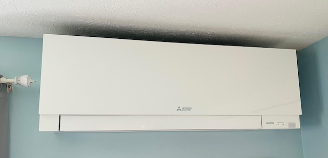 29 Chipman Rd, Sandwich, MA 02563 - details featuring a textured ceiling and a wall mounted AC