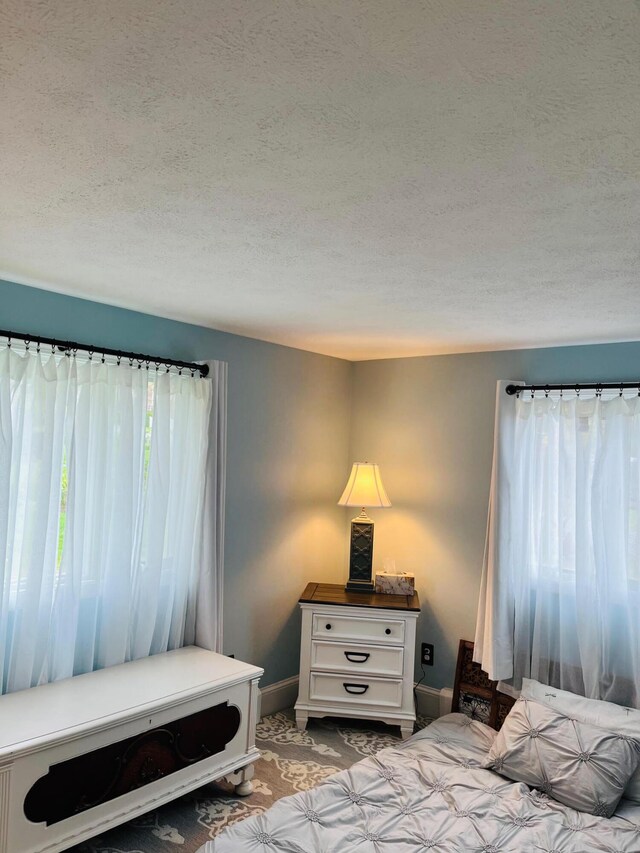 29 Chipman Rd, Sandwich, MA 02563 - bedroom featuring a textured ceiling and baseboards