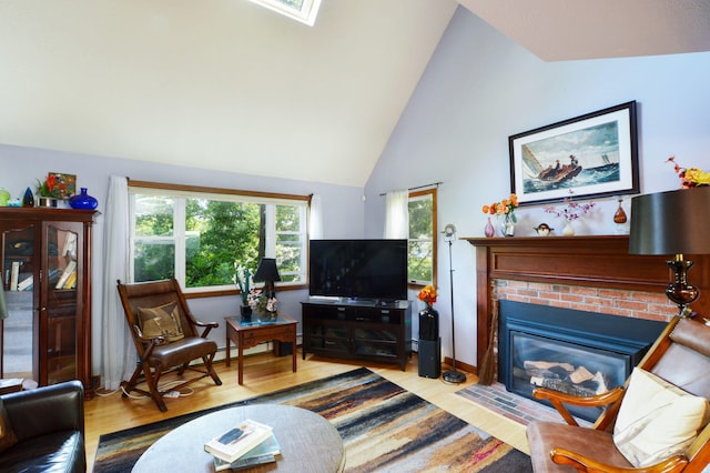 59 Whitecaps Dr, East Falmouth, MA 02536 - living area with wood finished floors, a brick fireplace, and high vaulted ceiling