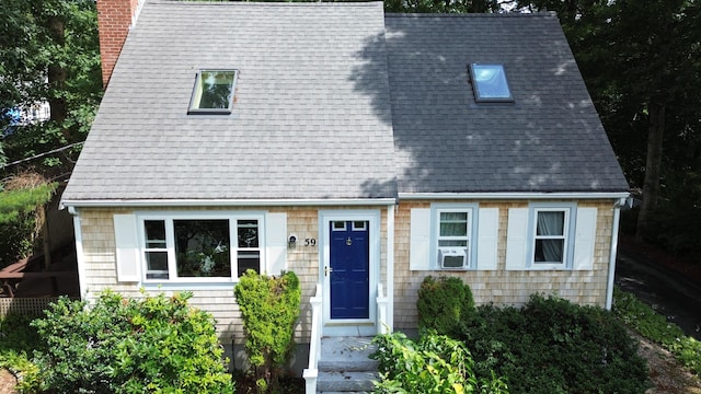 59 Whitecaps Dr, East Falmouth, MA 02536 - view of front of home with a chimney, cooling unit, and a shingled roof