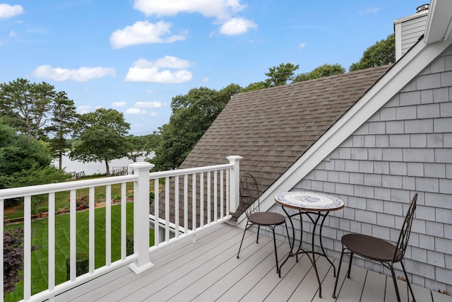 wooden deck with a yard