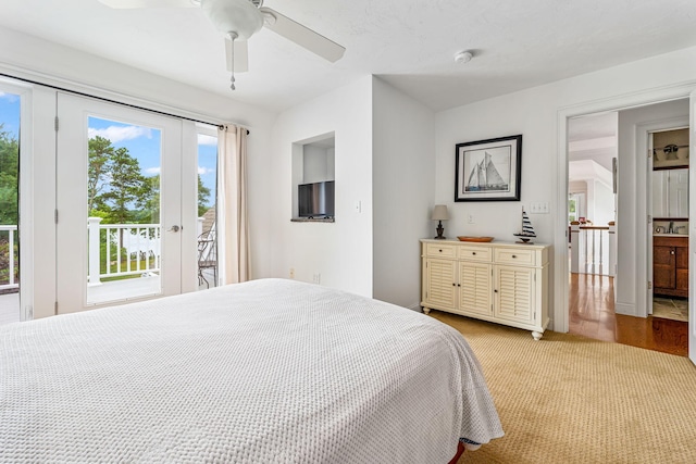 bedroom with access to exterior, light carpet, and ceiling fan