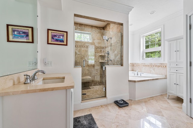 bathroom with crown molding, a stall shower, vanity, baseboards, and a bath