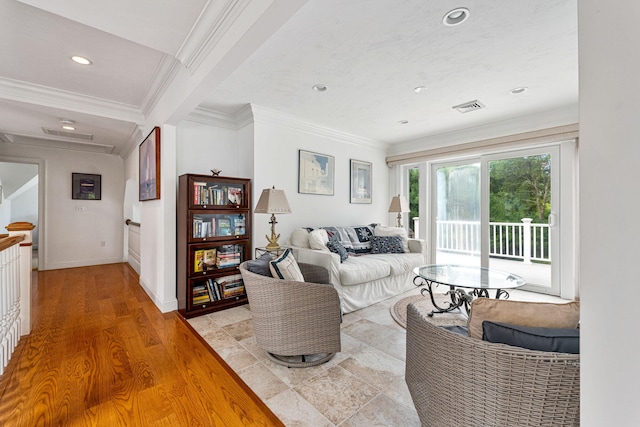 living area with baseboards, visible vents, crown molding, light wood-type flooring, and recessed lighting