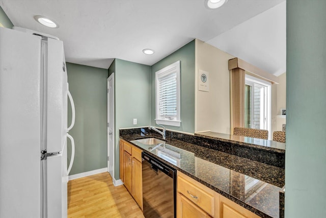 bathroom with recessed lighting, baseboards, wood finished floors, and vanity