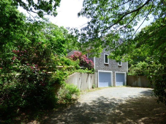 view of side of property featuring a garage