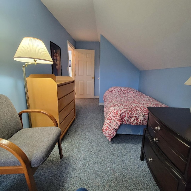 carpeted bedroom featuring lofted ceiling