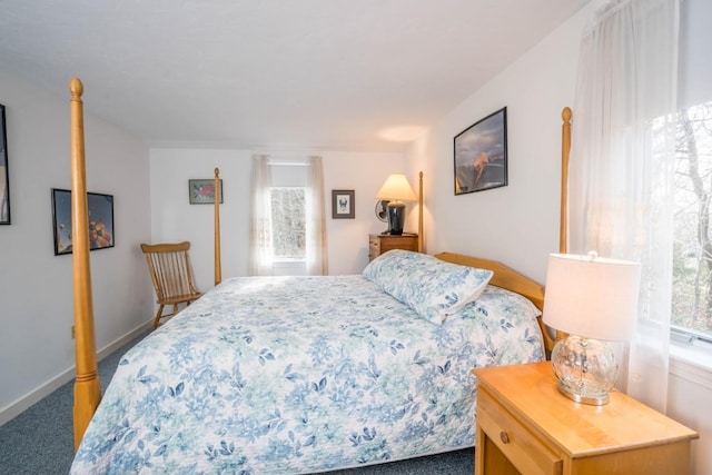 bedroom featuring dark carpet