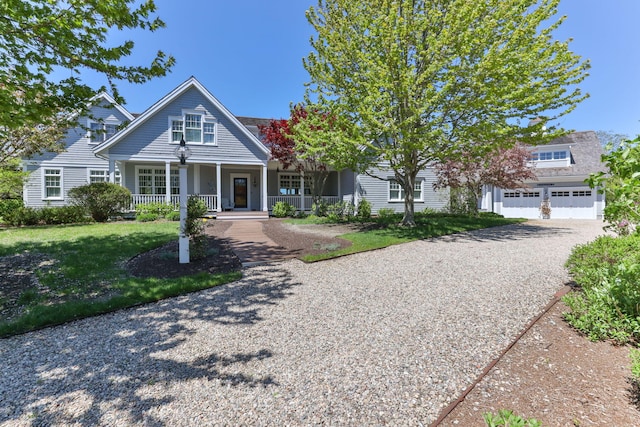 20 Boat Meadow Way, Eastham, MA 02642 - view of front facade with a porch, a front lawn, and driveway