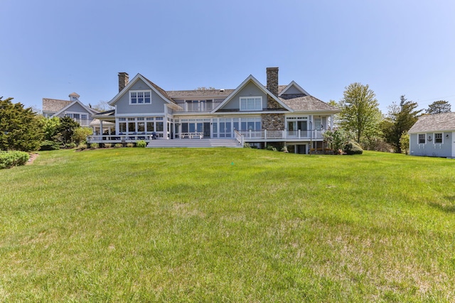 20 Boat Meadow Way, Eastham, MA 02642 - back of property featuring a lawn, a chimney, and a deck