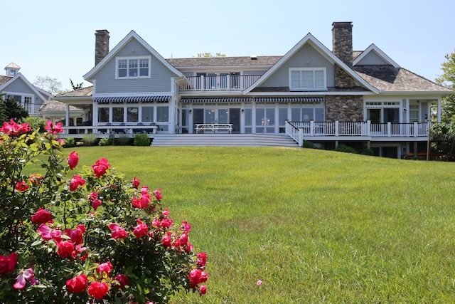 20 Boat Meadow Way, Eastham, MA 02642 - rear view of property featuring a chimney, a balcony, a lawn, and stone siding