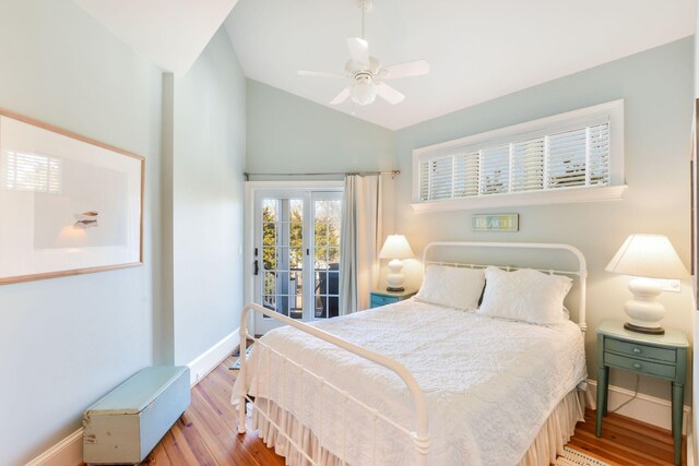 bedroom featuring wood finished floors, ceiling fan, baseboards, lofted ceiling, and access to exterior