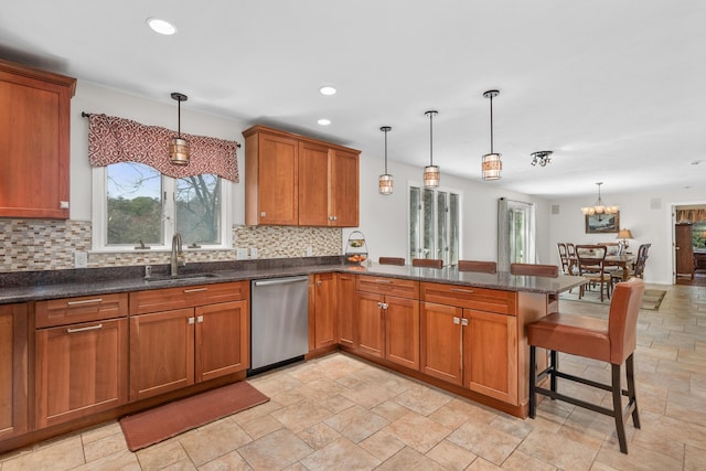 29 Water View Cir, Centerville, MA 02632 - kitchen with dishwasher, a sink, brown cabinets, tasteful backsplash, and a peninsula