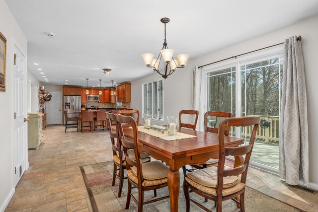 29 Water View Cir, Centerville, MA 02632 - dining space featuring stone tile floors, baseboards, recessed lighting, and a chandelier