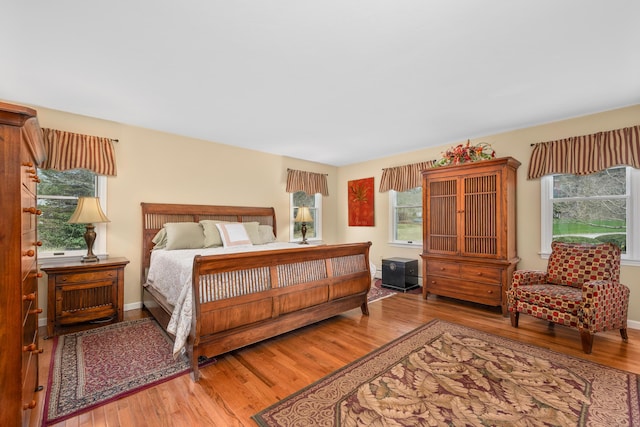 29 Water View Cir, Centerville, MA 02632 - bedroom featuring multiple windows, wood finished floors, and baseboards