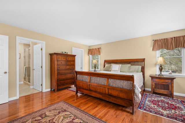 29 Water View Cir, Centerville, MA 02632 - bedroom with wood finished floors, multiple windows, and baseboards