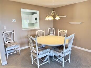 6 Sea Cliff Dr E Unit 6, Cedarville, MA 02360 - carpeted dining area featuring a chandelier and baseboards