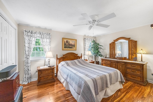 441 Buck Island Rd Unit B1, West Yarmouth, MA 02673 - bedroom featuring light wood-type flooring, a closet, a ceiling fan, and a baseboard radiator
