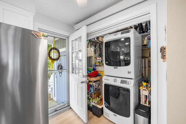441 Buck Island Rd Unit B1, West Yarmouth, MA 02673 - laundry area featuring stacked washer / drying machine, light wood finished floors, and healthy amount of natural light