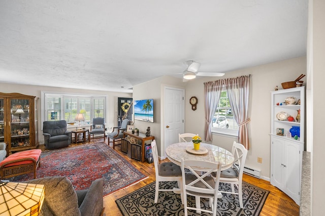 441 Buck Island Rd Unit B1, West Yarmouth, MA 02673 - dining space with wood finished floors, a ceiling fan, and baseboard heating