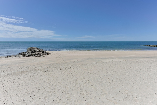 view of water feature with a beach view
