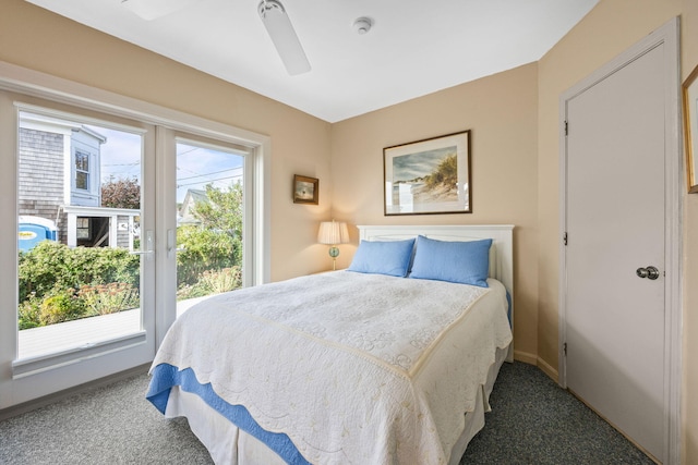 carpeted bedroom featuring ceiling fan and multiple windows