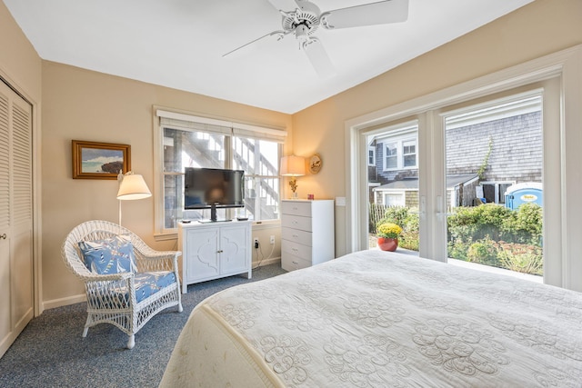 bedroom with a closet, ceiling fan, and carpet floors