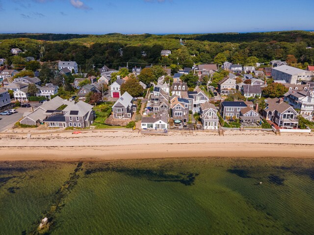 bird's eye view featuring a water view and a beach view