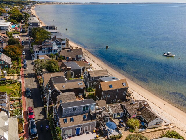 aerial view with a water view and a view of the beach