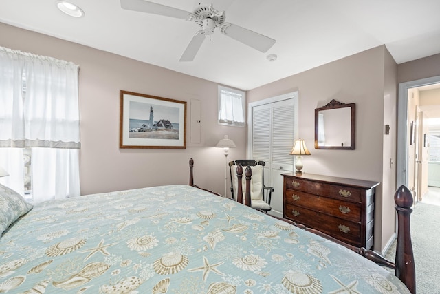 bedroom with ceiling fan and a closet