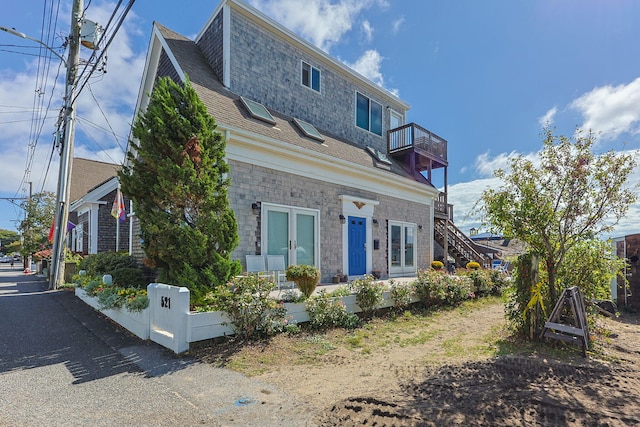 view of front of property with a balcony