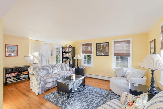 living room with baseboard heating and hardwood / wood-style floors