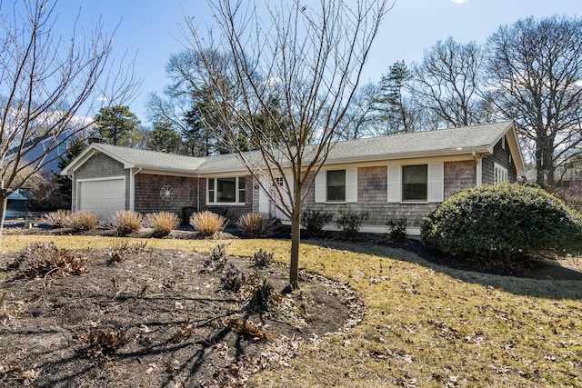 ranch-style home with an attached garage and roof with shingles