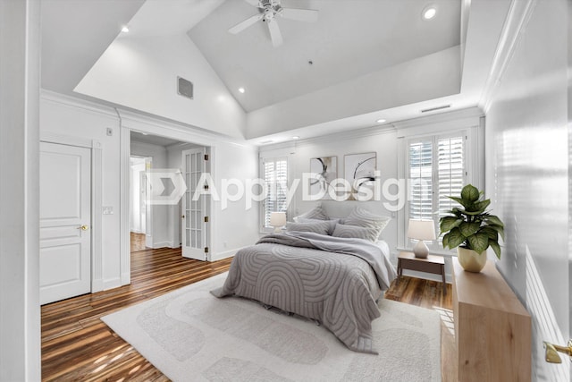 bedroom with crown molding, ceiling fan, dark hardwood / wood-style floors, and high vaulted ceiling