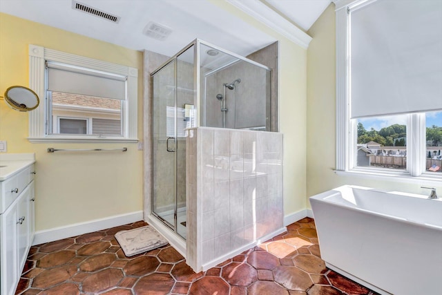 bathroom with independent shower and bath and vanity