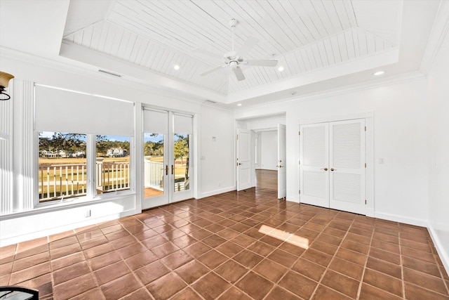 interior space with ornamental molding, wood ceiling, and a tray ceiling